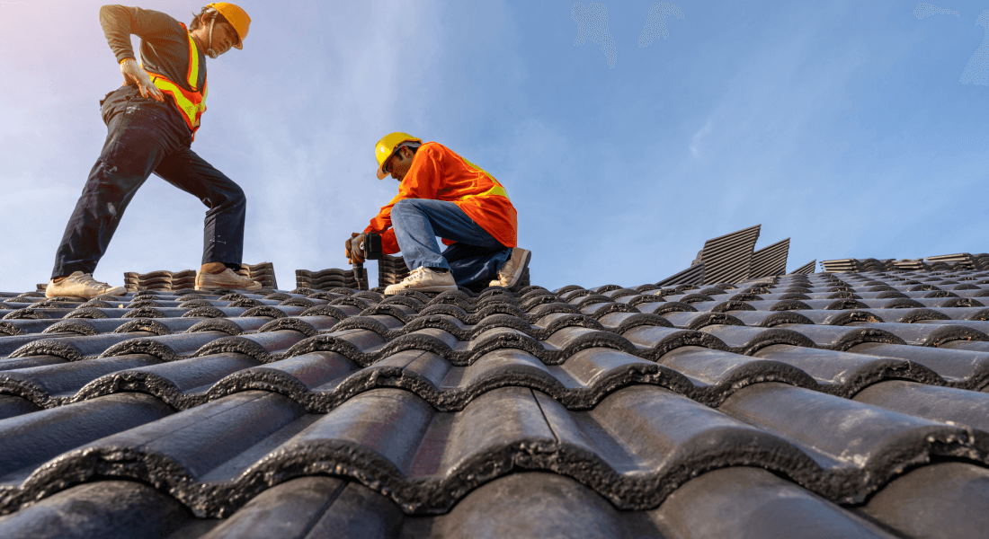 Roofers completing roof cornering work